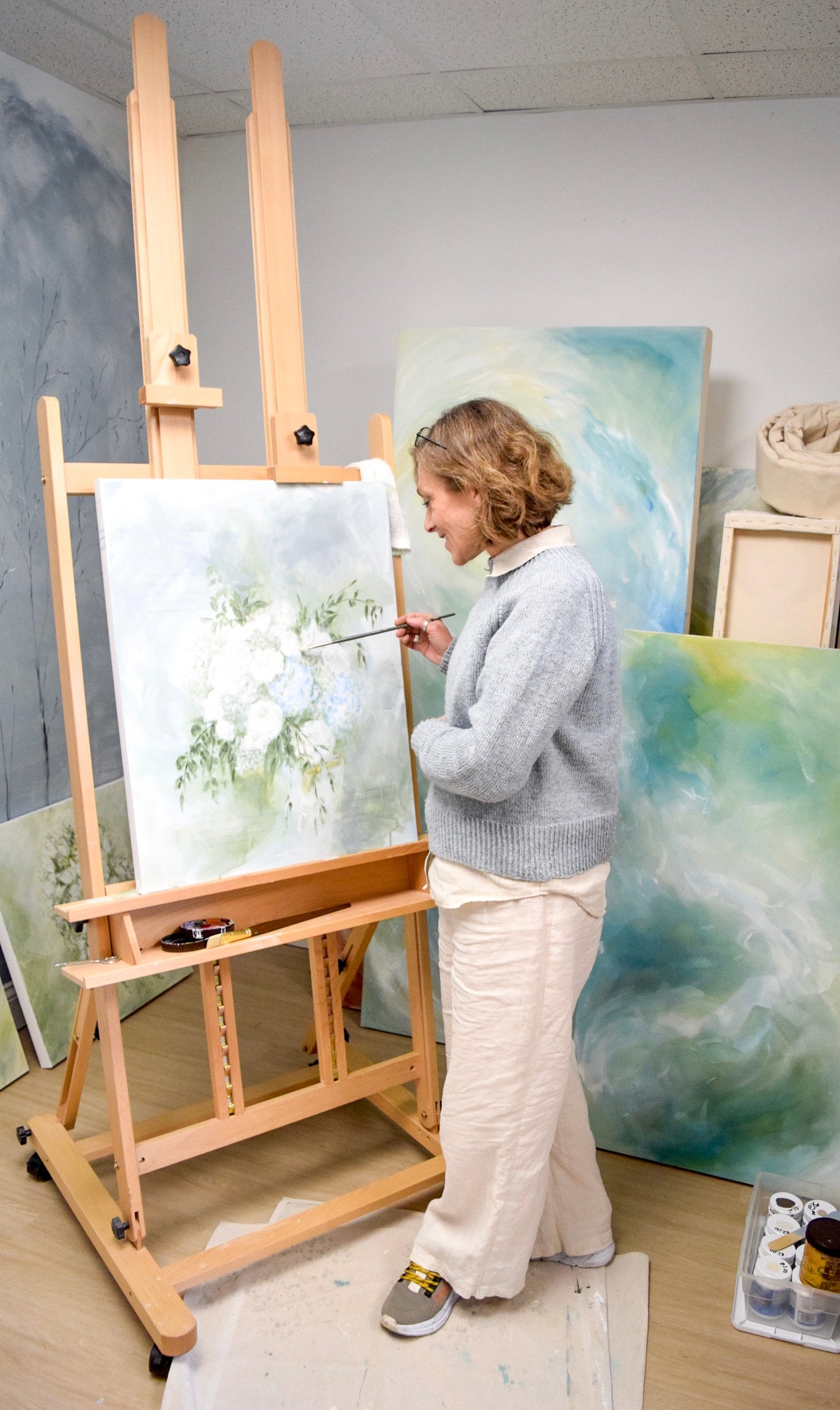 Artist painting bride's bouquet as preservation technique to make a family keepsake.