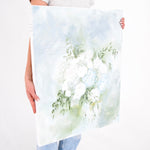 White flowers mixed with blue hydrangeas in bouquet painted as keepsake.