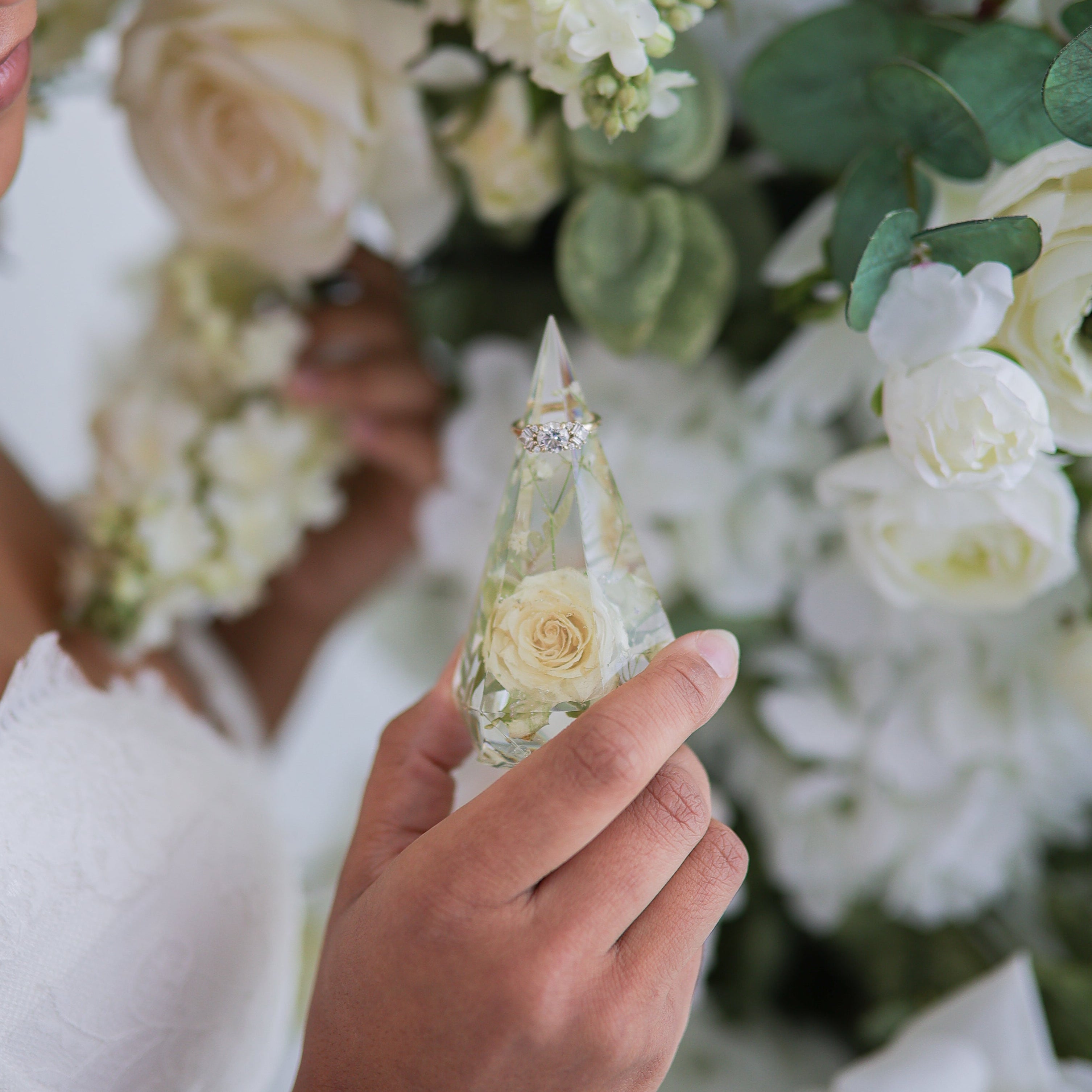 Resin ring holder custom made with wedding flowers.