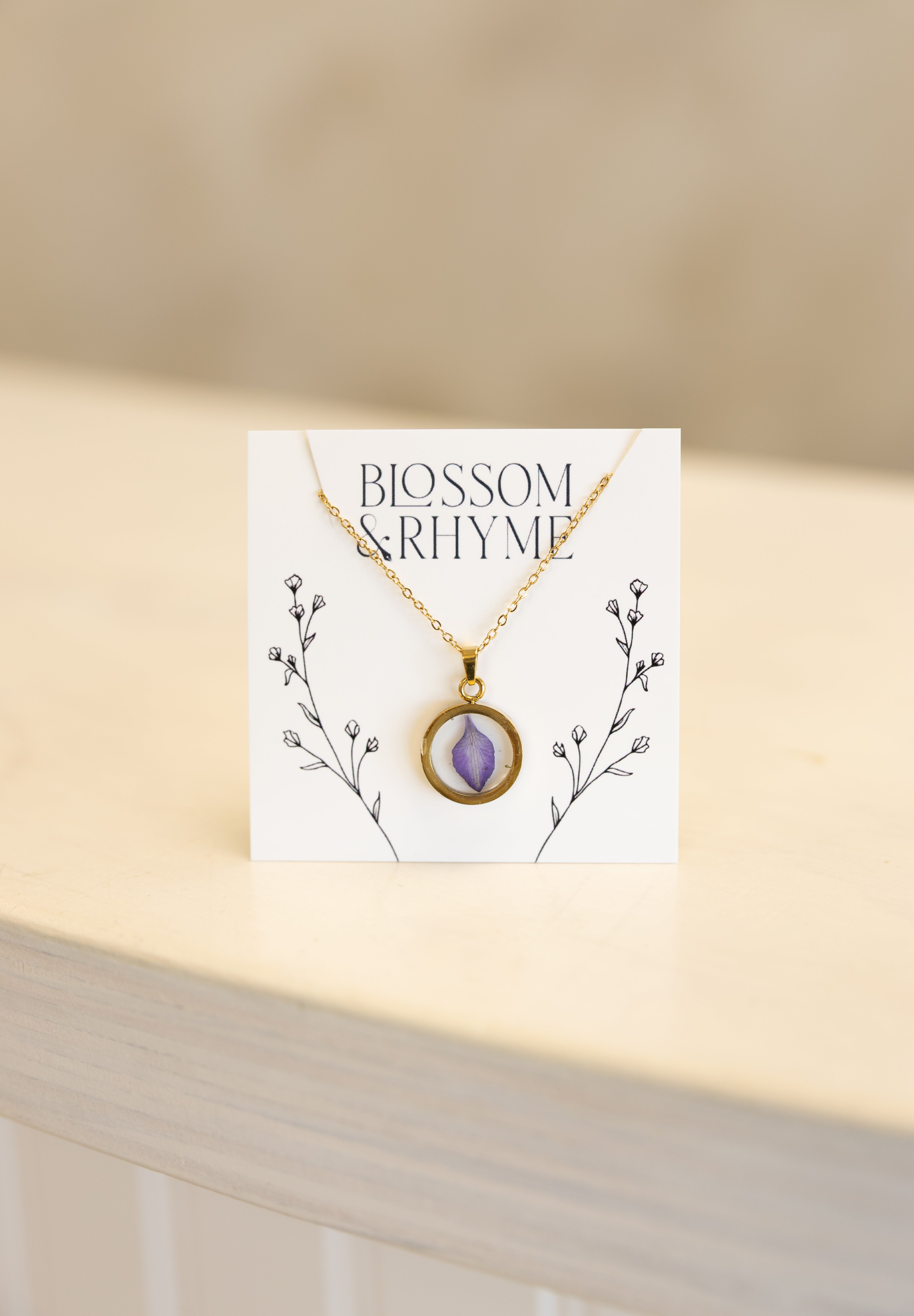 July birth month flower - larkspur pressed into a pendant necklace keepsake.