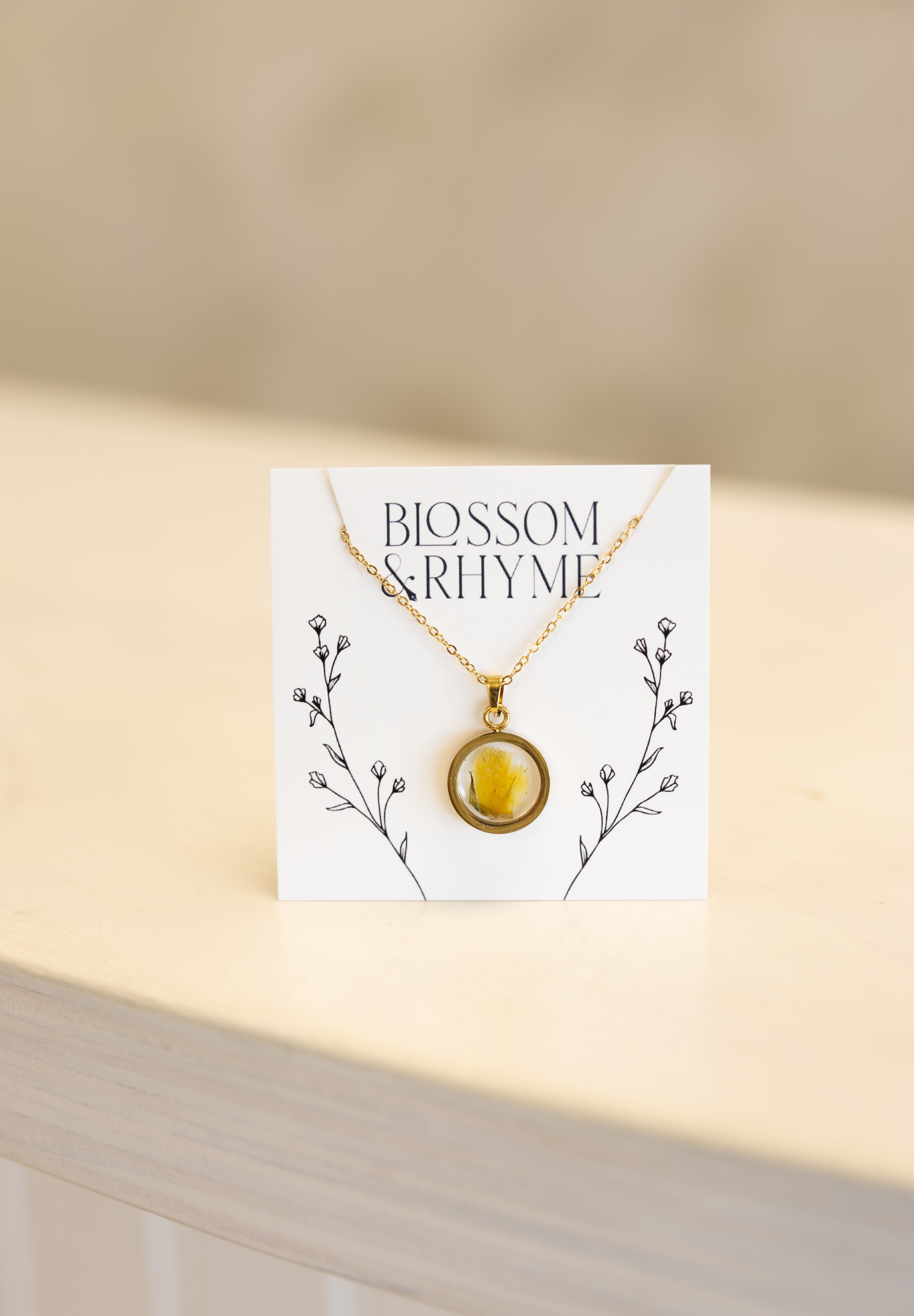 October birth month flower - marigold pressed into a pendant necklace keepsake.