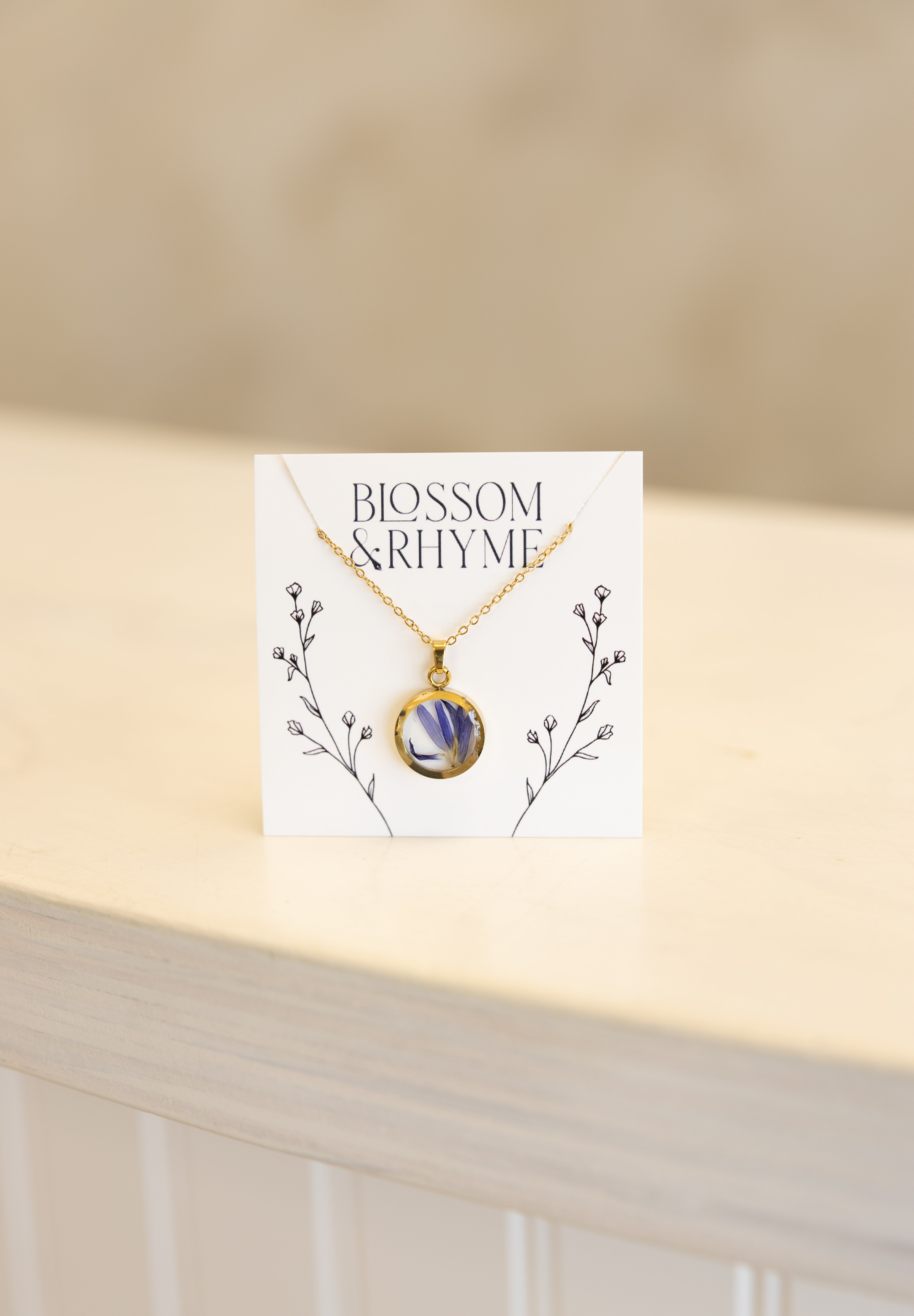 September birth month flower - aster pressed into a pendant necklace keepsake.