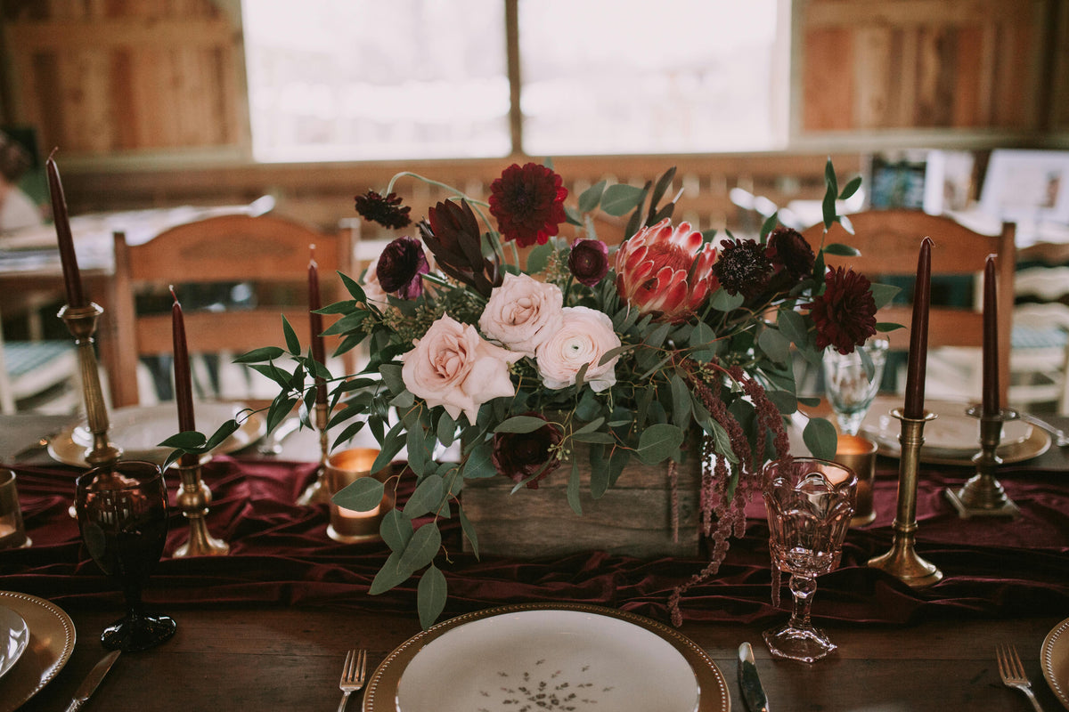 10 wedding floral centerpiece with fresh seasonal flowers, candles, and lush greenery styled on a romantic reception table.