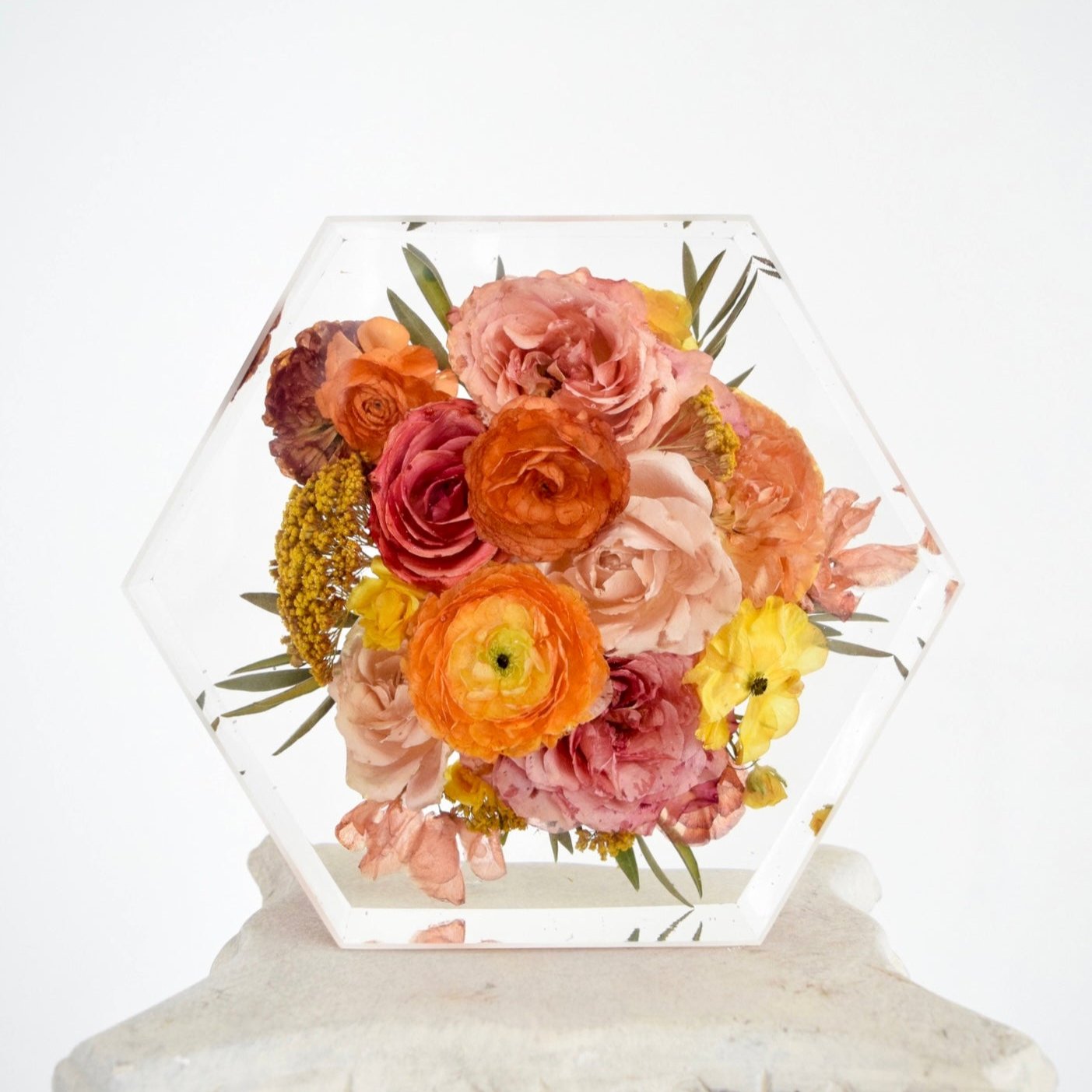 Preserved memorial flowers transformed into a custom resin and pressed floral keepsake honoring life's meaningful moments and lasting memories.