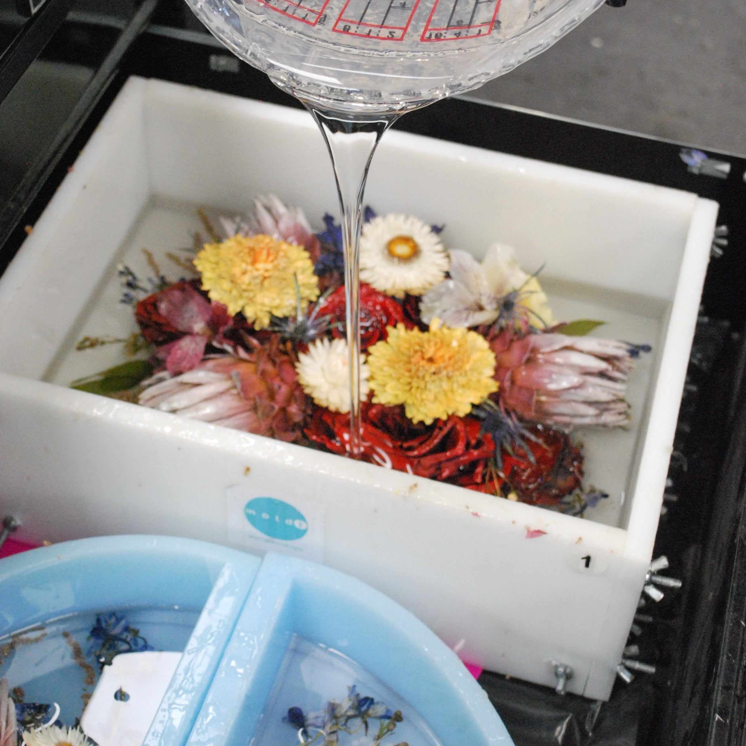Professional flower preservation of a wedding bouquet compared with DIY flower preservation methods using pressed flowers and resin keepsakes.