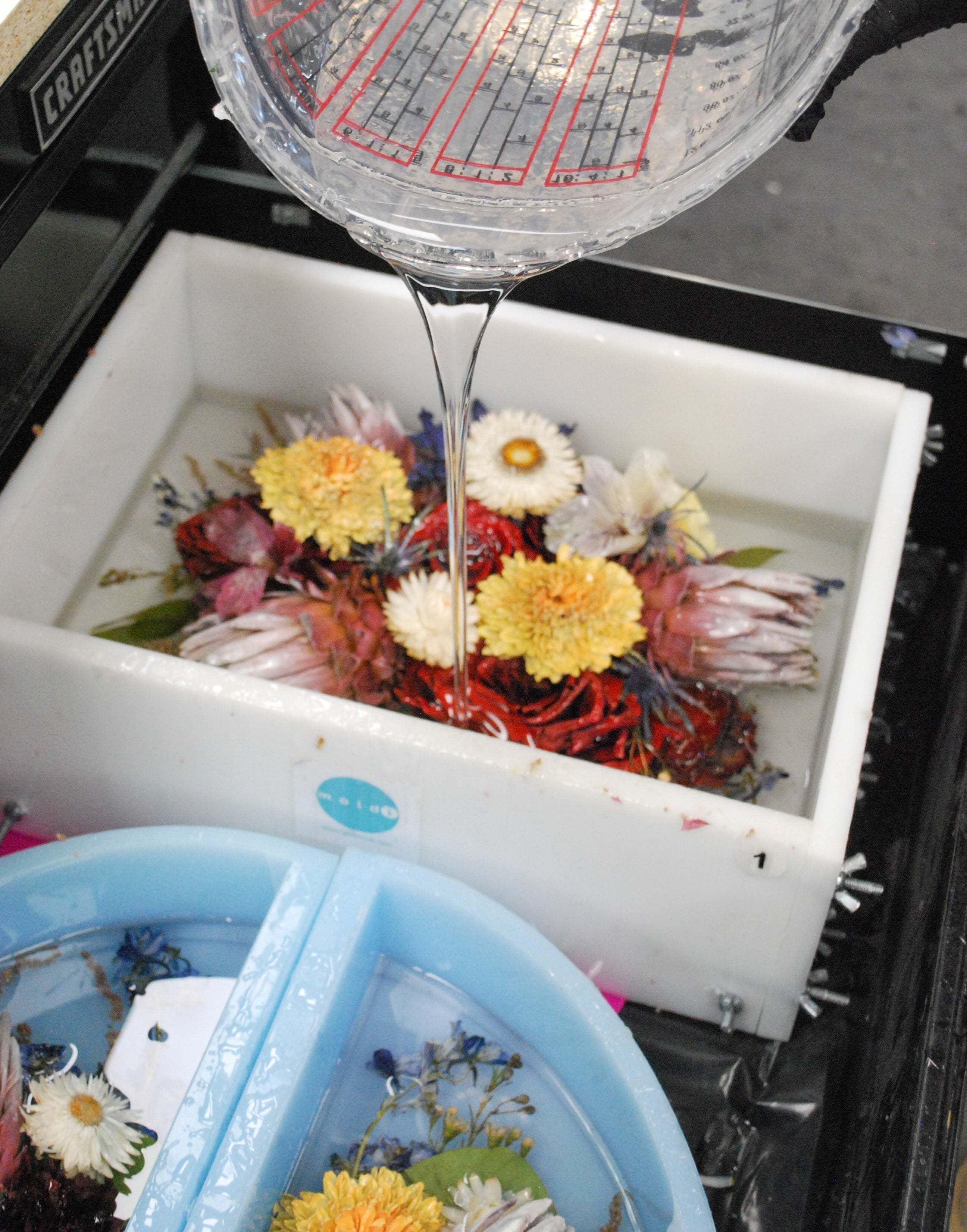 Professional flower preservation of a wedding bouquet compared with DIY flower preservation methods using pressed flowers and resin keepsakes.