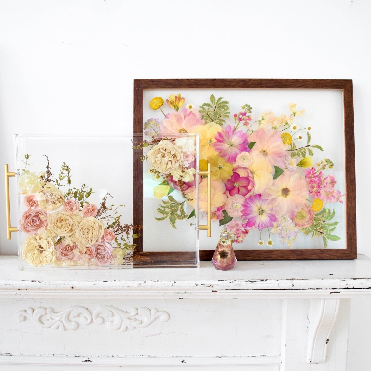 Comparison of resin vs pressed flowers featuring a preserved wedding bouquet in resin and framed pressed flower artwork.