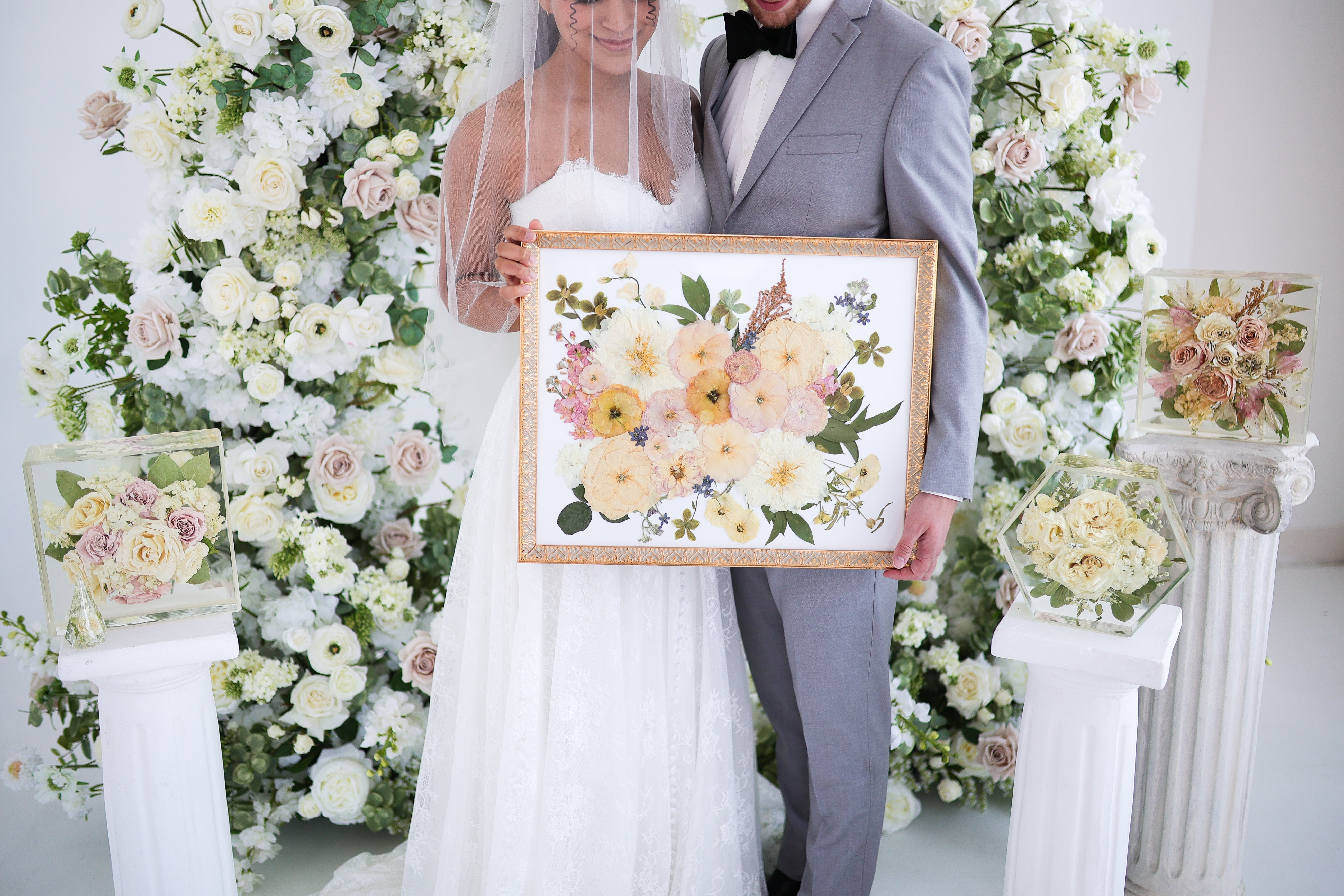 Wedding bouquet displayed in a crystal-clear resin keepsake, showcasing custom wedding flower preservation and timeless floral heirloom art.