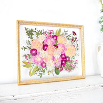 16x20 frame of pressed pink wedding flowers.