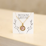 August birth month flower - poppy pressed into a pendant necklace keepsake.