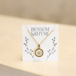 December birth month flower - narcissus pressed into a pendant necklace keepsake.