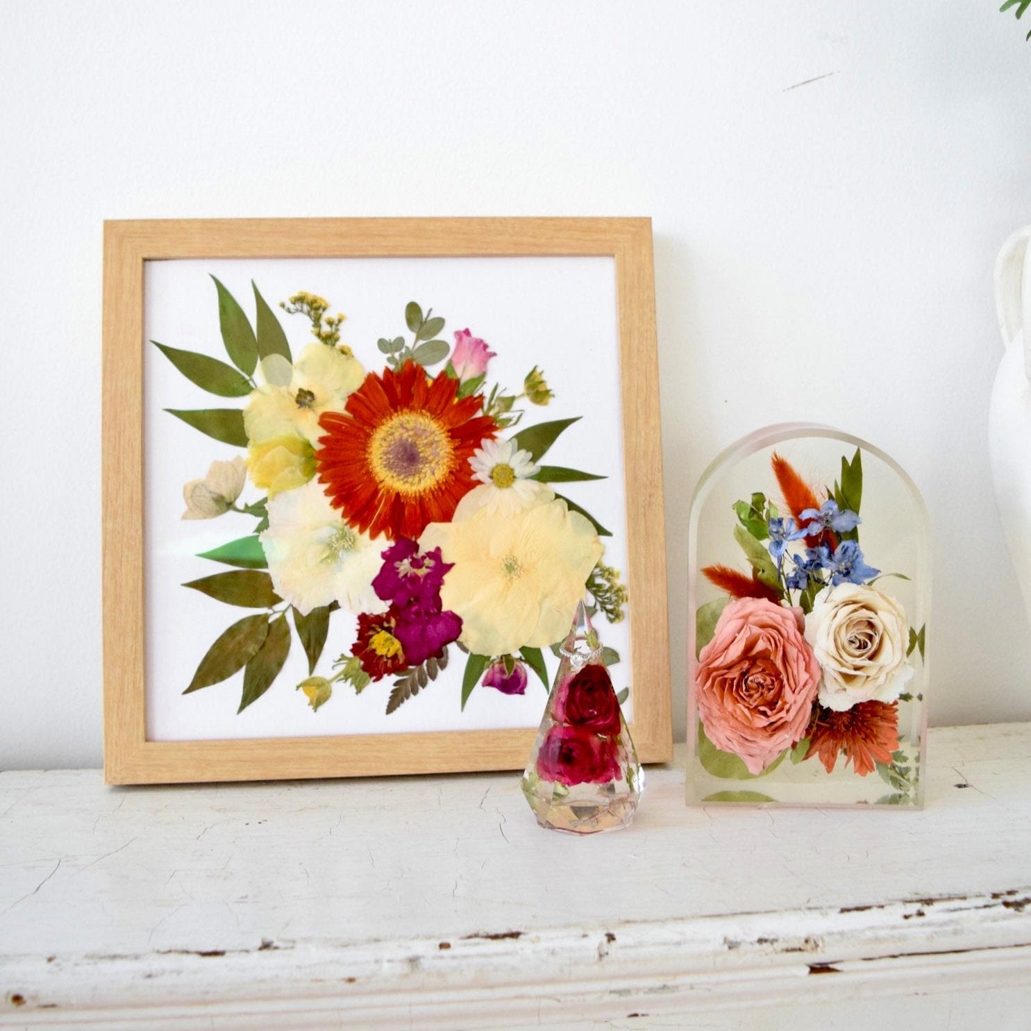 Emily's Herbarium Collection featuring a pressed floral frame, resin floral arch, and botanical keepsake handcrafted from preserved wedding bouquet flowers by Blossom & Rhyme
