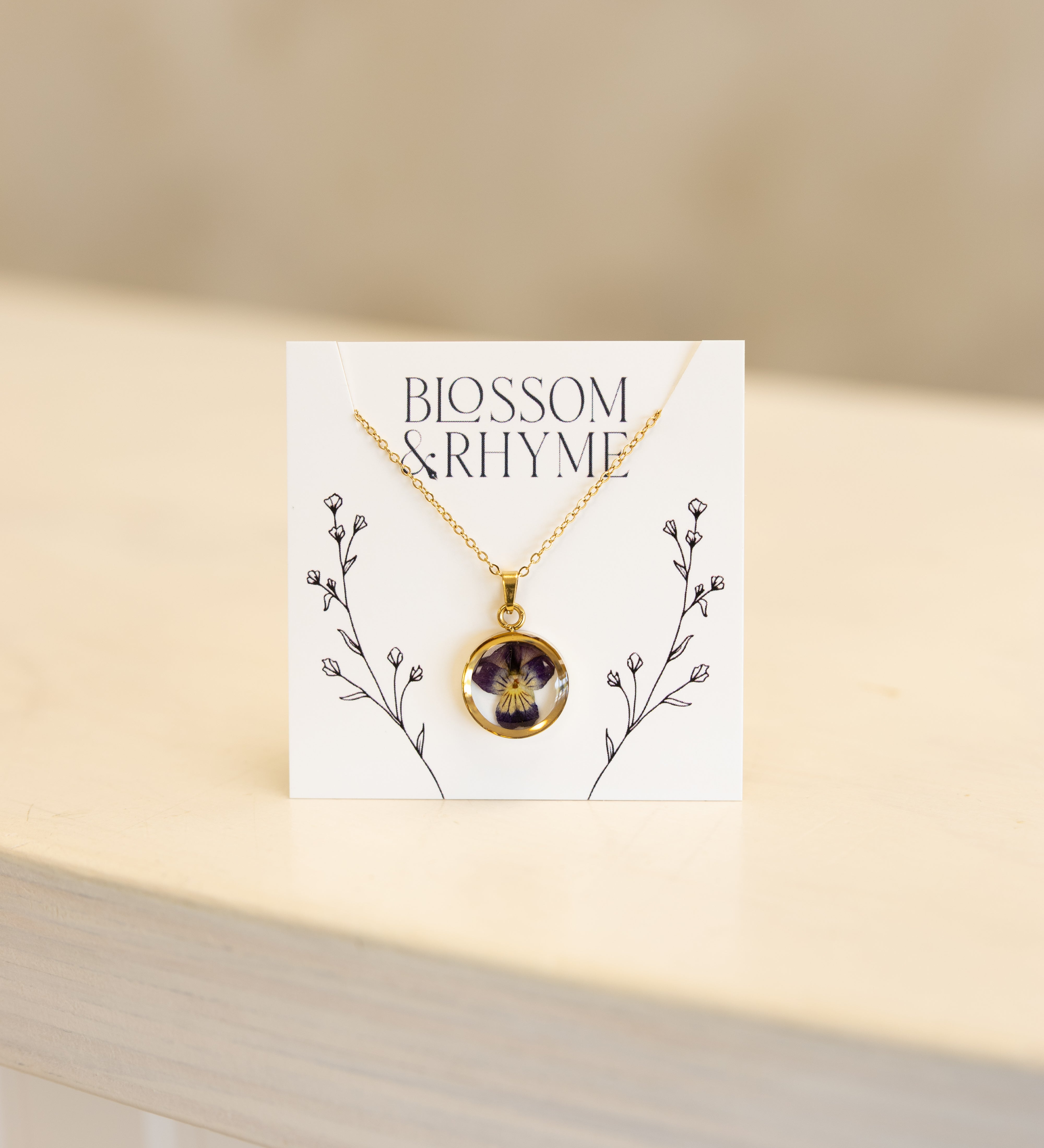 February birth month flower - violet pressed into a pendant necklace keepsake.