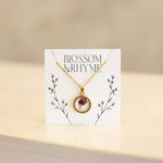 January birth month flower - carnation pressed into a pendant necklace keepsake.