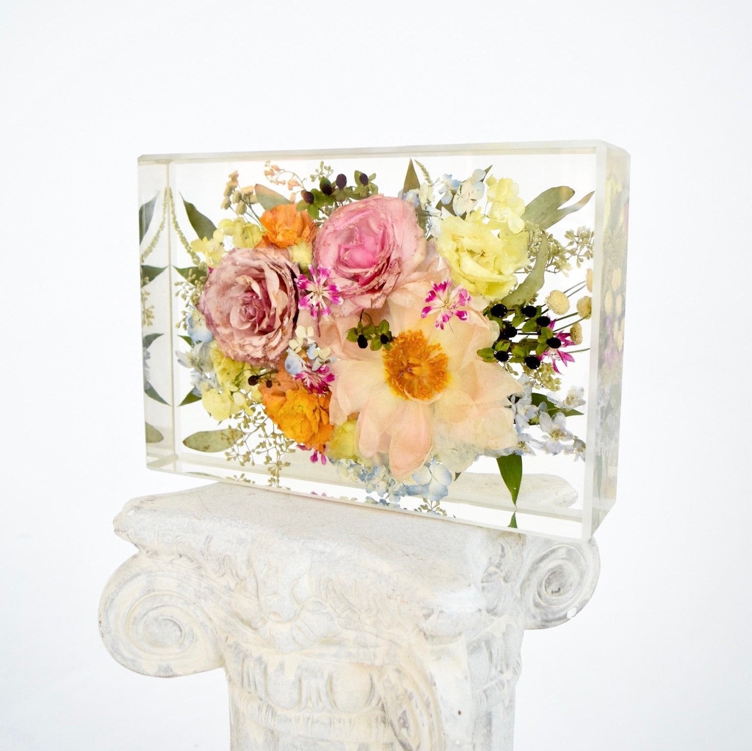 Large floral rectangle preserving blush garden roses, peach cosmos, yellow ranunculus, blue hydrangeas, white hydrangeas, eucalyptus, wax flowers, and seasonal greenery in clear resin, handcrafted by Blossom & Rhyme