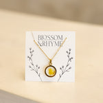 March birth month flower - daffodil pressed into a pendant necklace keepsake.
