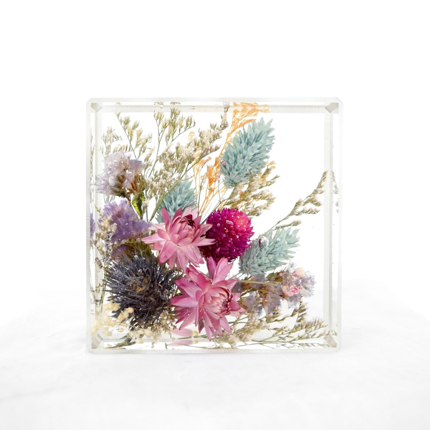 Mini floral block preserving pink strawflowers, purple sea lavender, blue thistle, bunny tail grass, dried botanicals, and wildflower accents in clear resin, handcrafted by Blossom & Rhyme