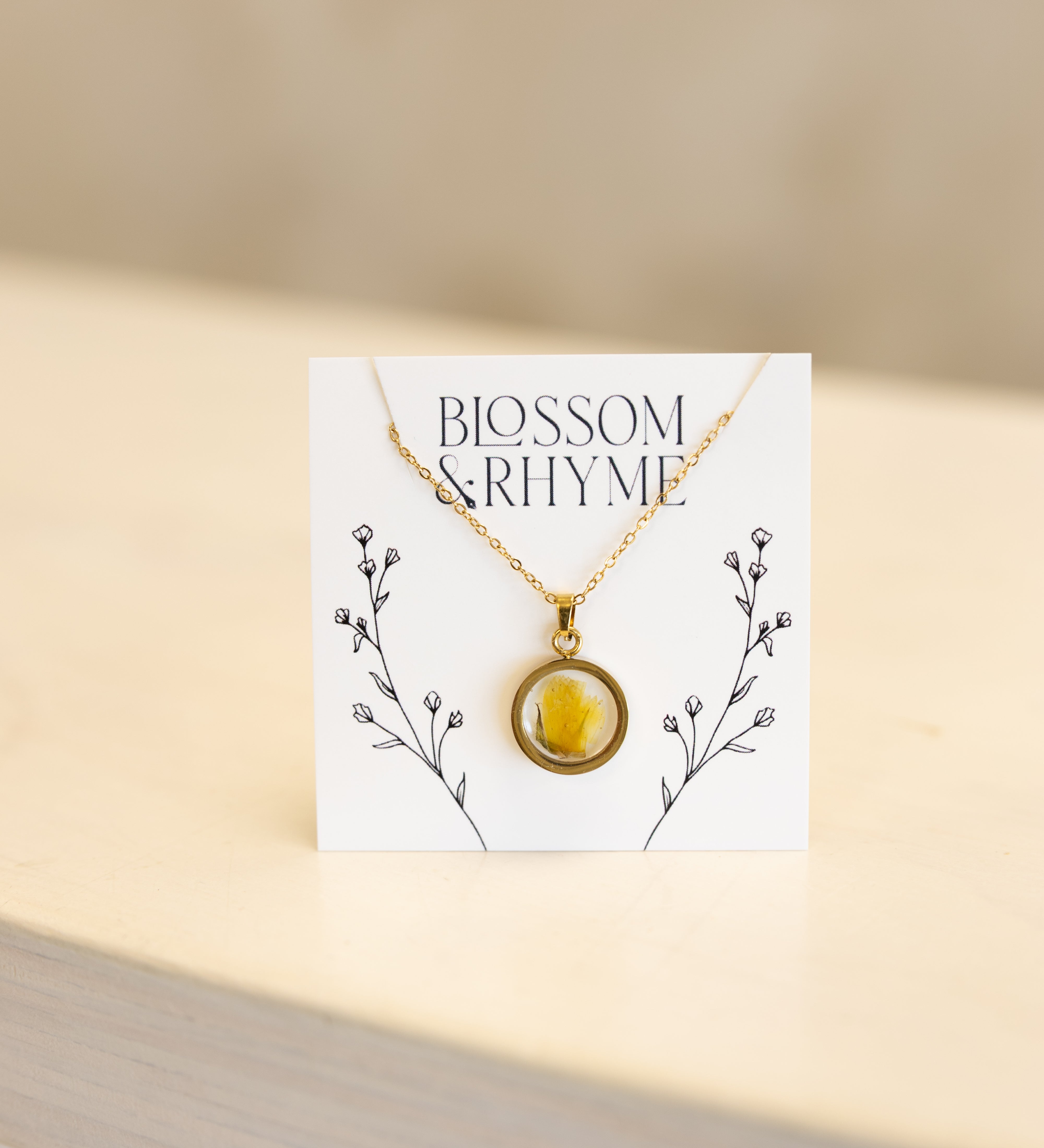 October birth month flower - marigold pressed into a pendant necklace keepsake.