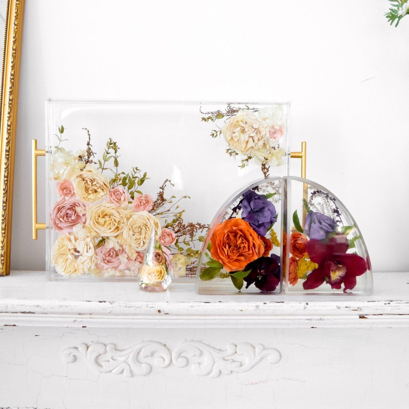 Blossom & Rhyme floral keepsake collection featuring a resin floral tray, small resin arches, and a faceted floral keepsake handcrafted from preserved wedding bouquet flowers