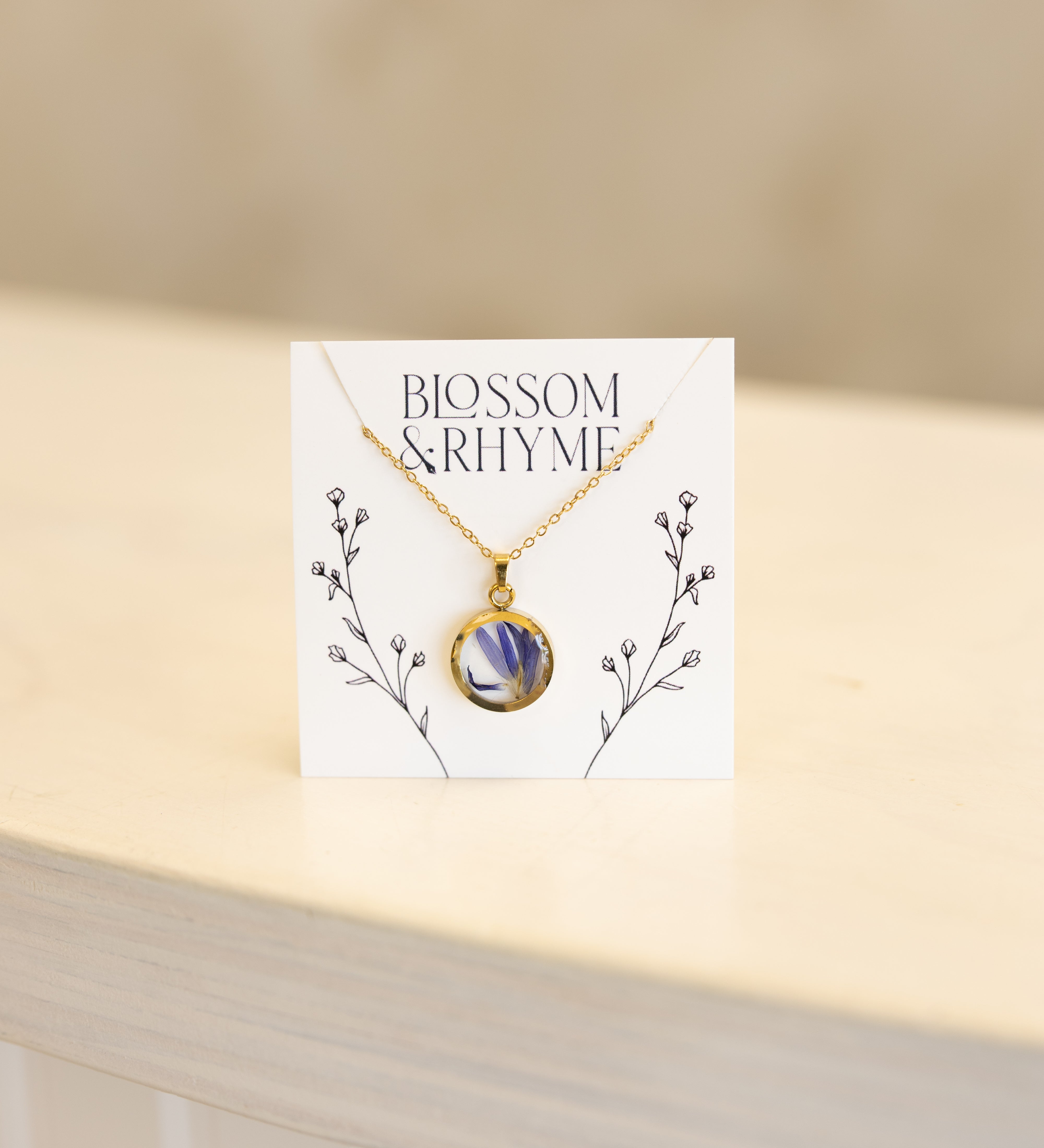 September birth month flower - aster pressed into a pendant necklace keepsake.