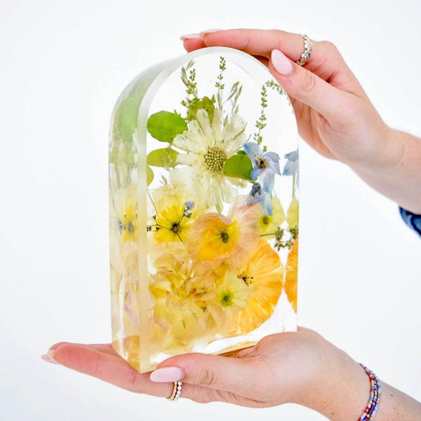 Small resin floral arch handcrafted with preserved wedding bouquet flowers by Blossom & Rhyme