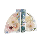 Small resin floral bookends handcrafted with preserved wedding bouquet flowers by Blossom & Rhyme