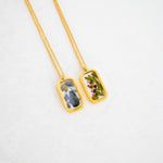 Small resin necklace pendant featuring preserved flowers by Blossom & Rhyme