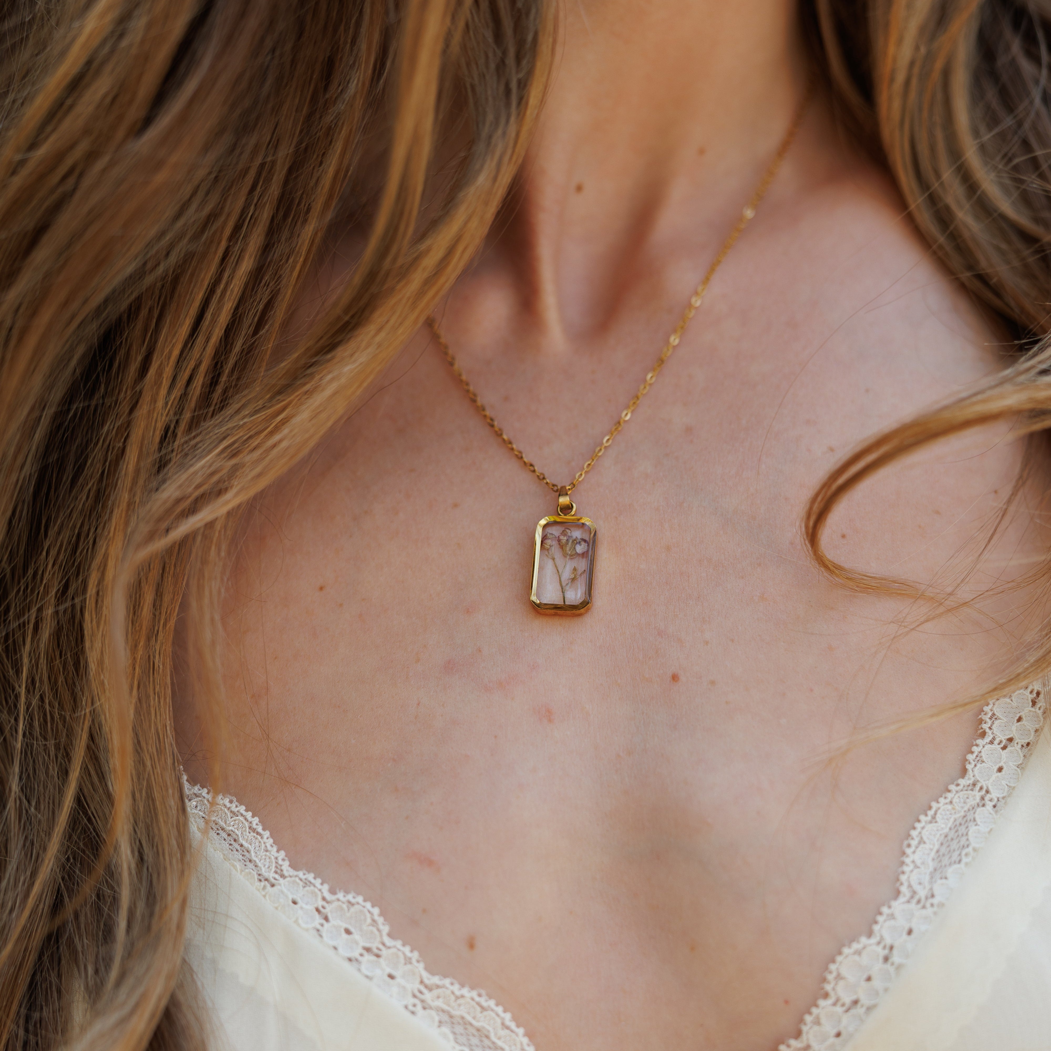 Custom preserved floral necklace handcrafted with real wedding flowers, transforming a bridal bouquet into a timeless floral keepsake and wearable heirloom.
