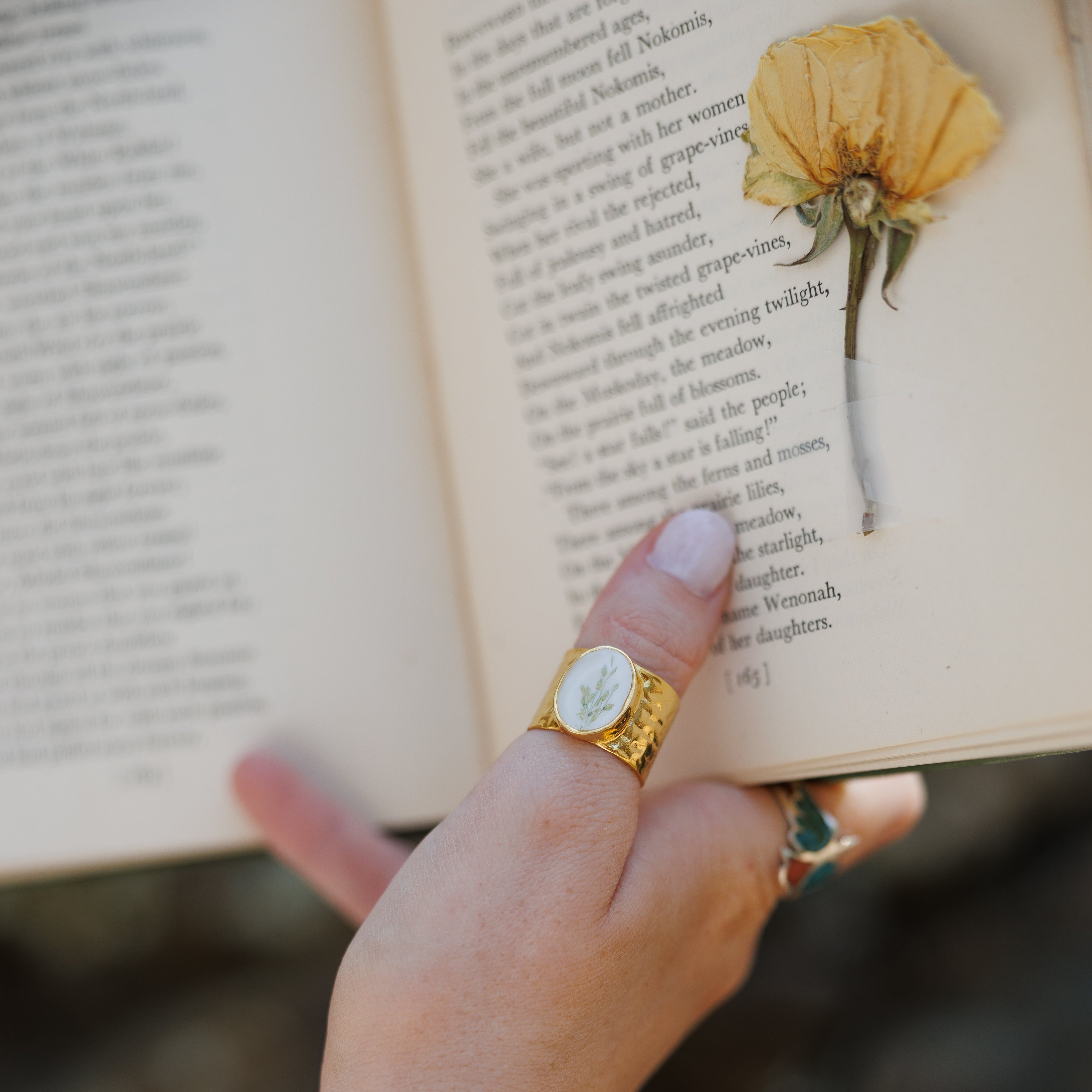Custom preserved floral ring handcrafted with real wedding flowers, creating a timeless floral jewelry keepsake from a bridal bouquet.