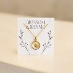 May birth month flower - lily of the valley pressed into a pendant necklace keepsake.
