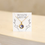 September birth month flower - aster pressed into a pendant necklace keepsake.