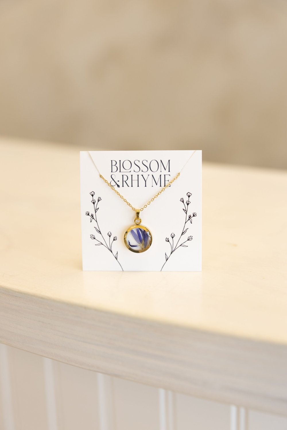 September birth month flower - aster pressed into a pendant necklace keepsake.