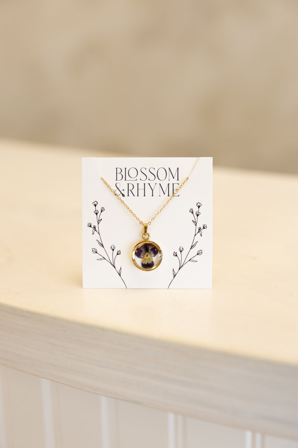 February birth month flower - violet pressed into a pendant necklace keepsake.