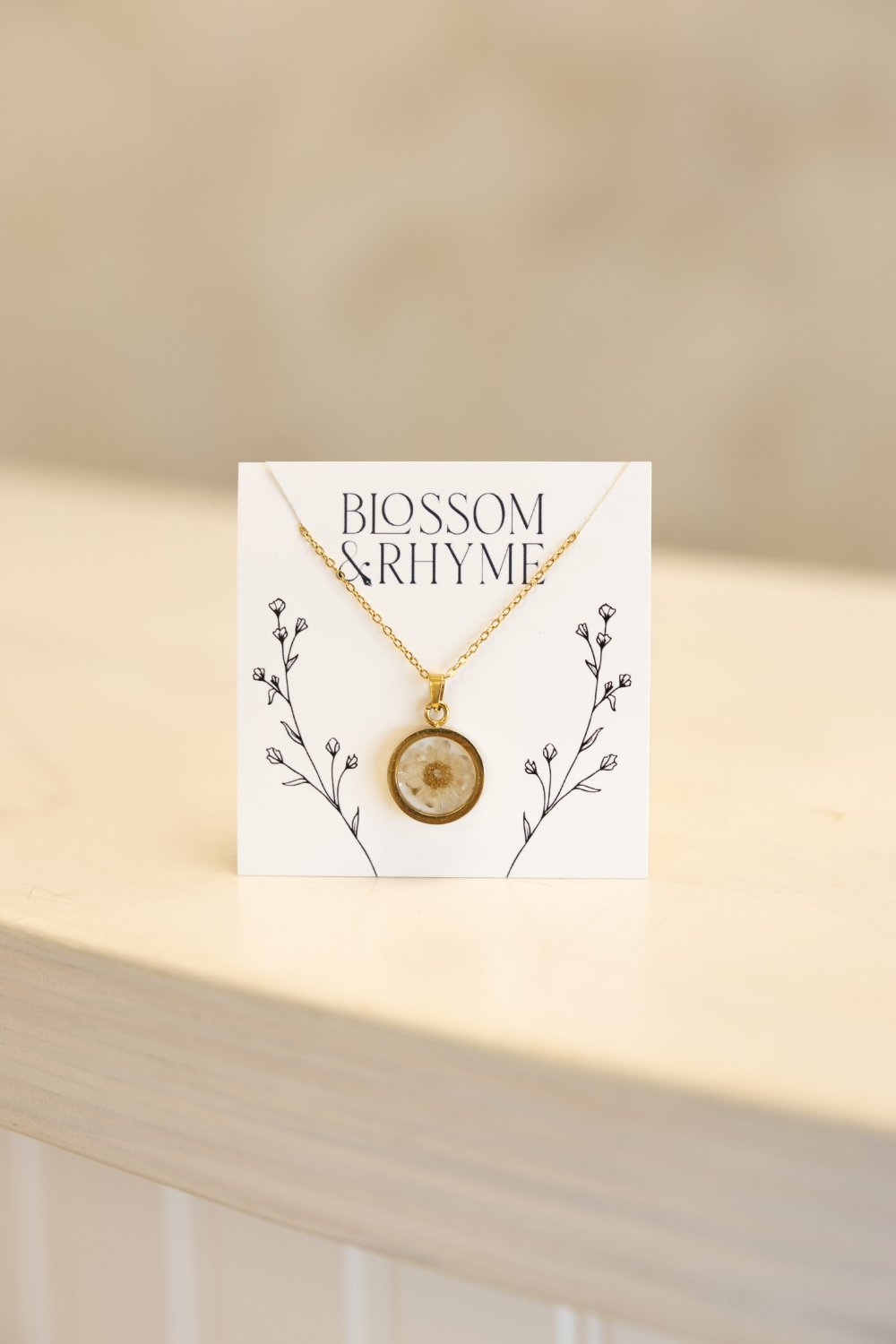 April birth month flower - daisy pressed into a pendant necklace keepsake.