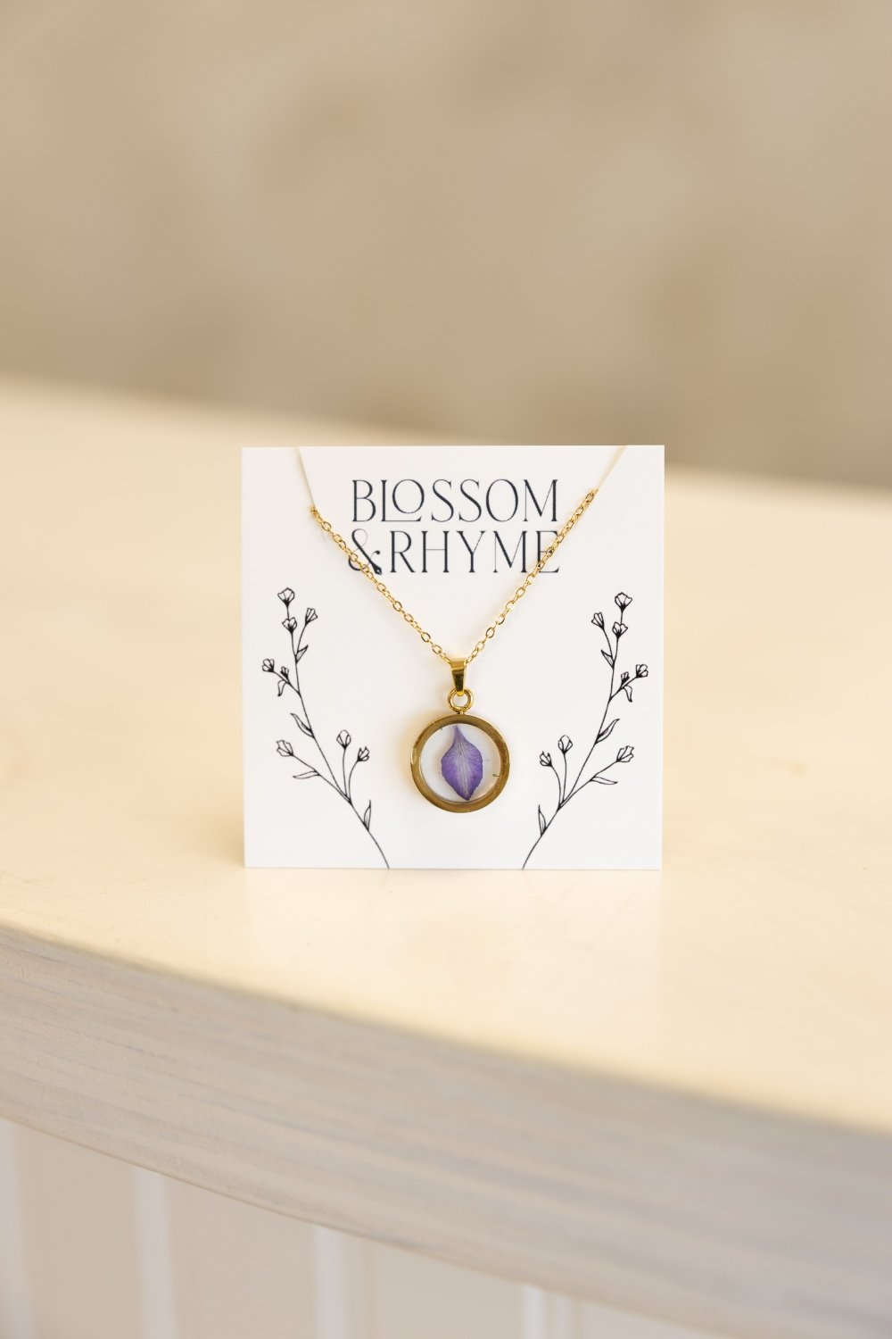 July birth month flower - larkspur pressed into a pendant necklace keepsake.