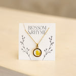 March birth month flower - daffodil pressed into a pendant necklace keepsake.