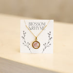 August birth month flower - poppy pressed into a pendant necklace keepsake.