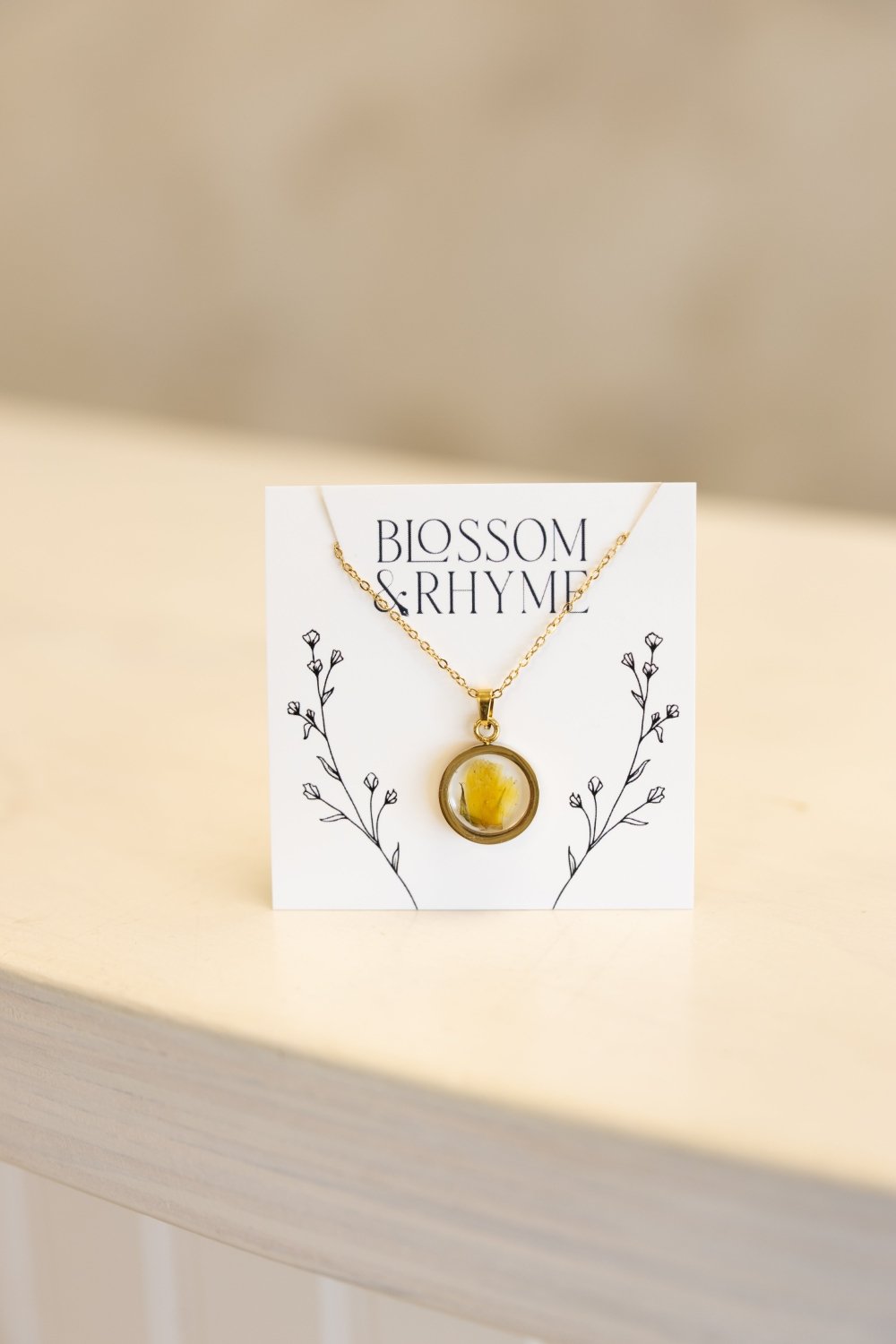 October birth month flower - marigold pressed into a pendant necklace keepsake.