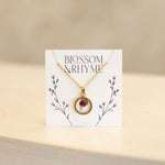 January birth month flower - carnation pressed into a pendant necklace keepsake.
