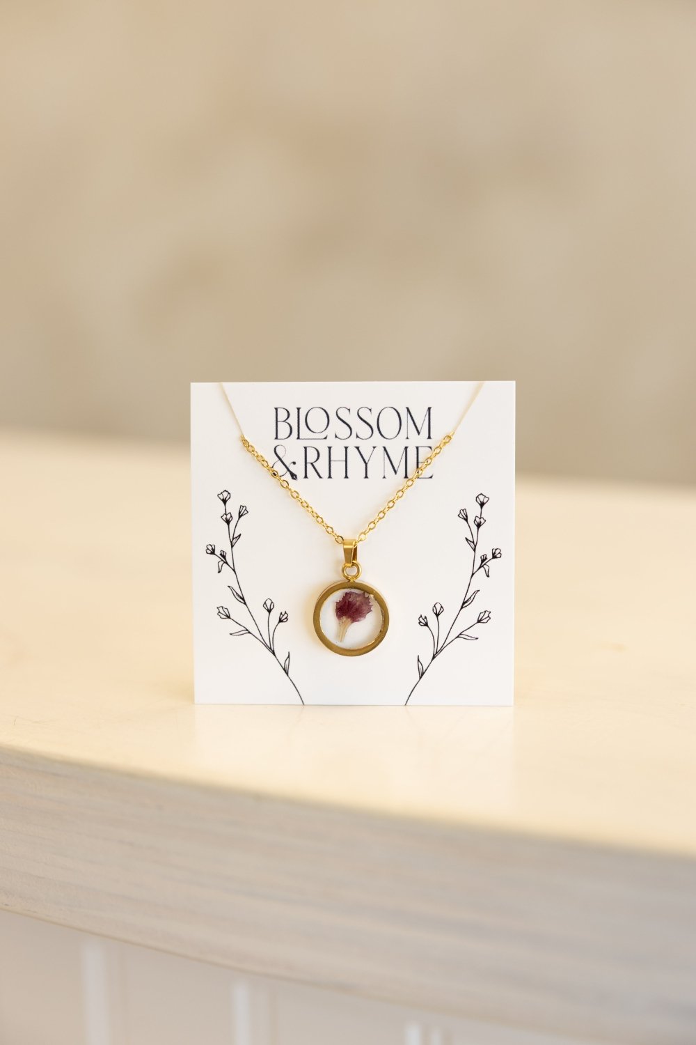 January birth month flower - carnation pressed into a pendant necklace keepsake.
